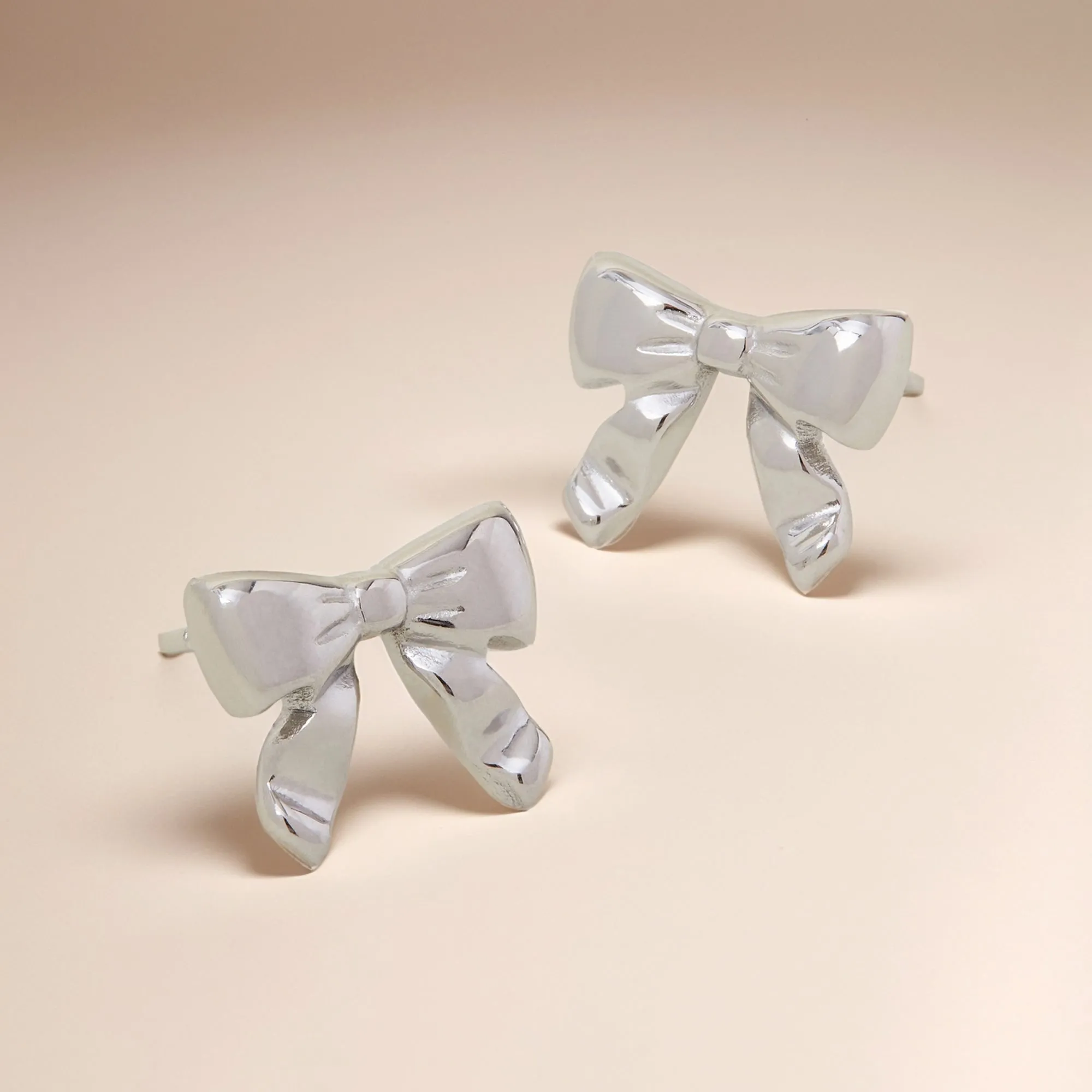 Platinum Plated Waterproof Bow Stud Earrings